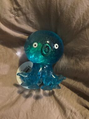 Clear Blue Octopus squishy with suction cups on the bottom to stick to your desk